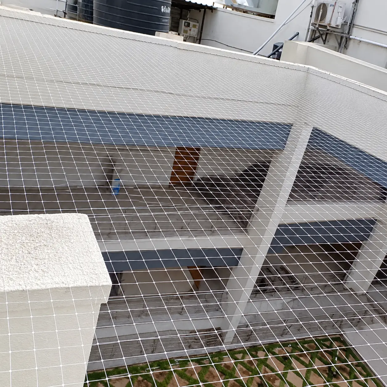 Protective bird netting fitted to a residential balcony